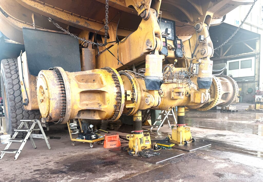 Mining truck under maintenance in a service facility.