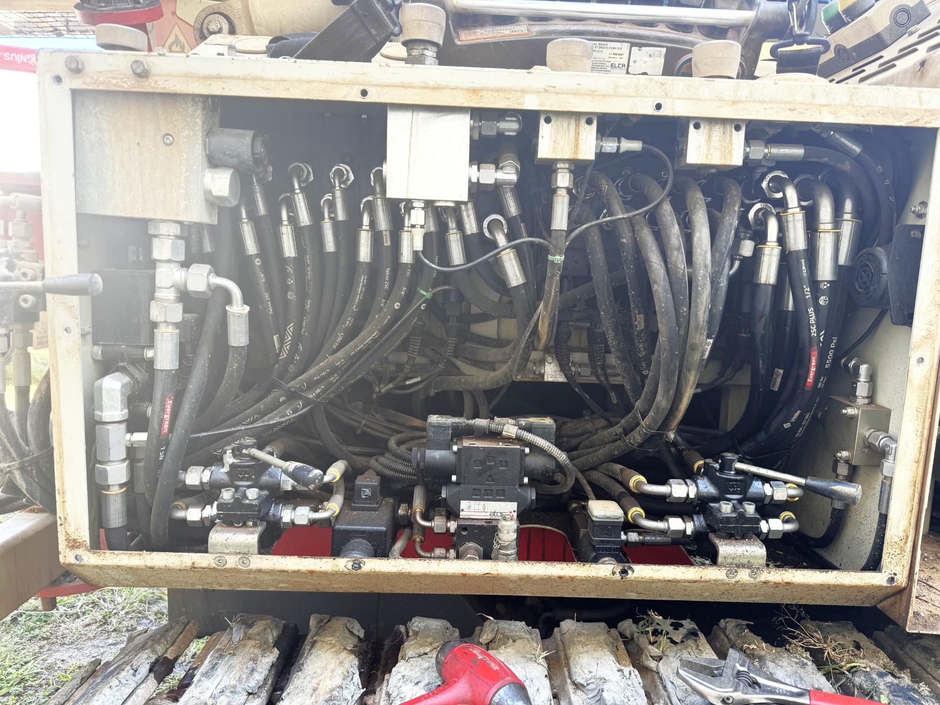 Detailed view of a hydraulic control system, including valves and pipes essential for system operation.
